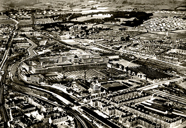 Clydebank Circa 1941. Looking  West, Singers  Clock  in centre of image. The category A target, the Dalnottar oil tanks  top left.